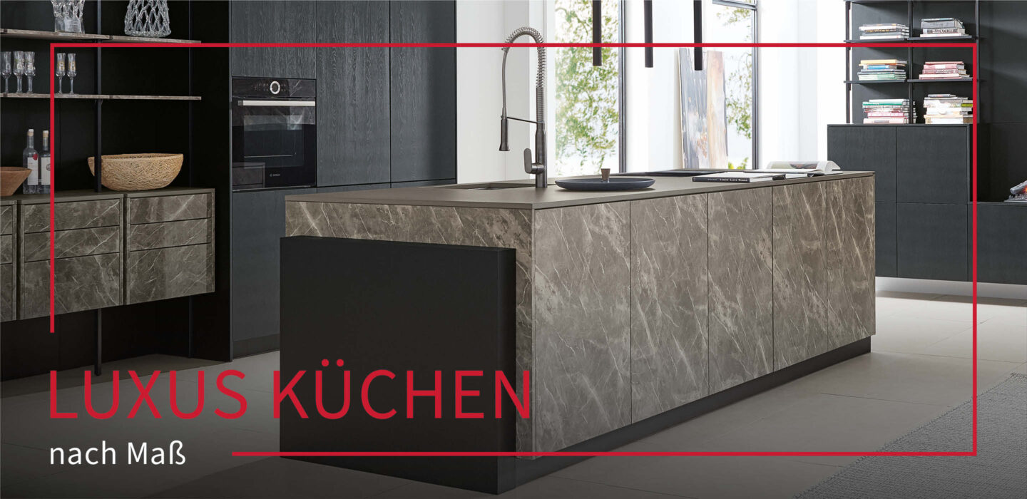 Graue Steinküche mit Kochinsel bei kitchen concepts by Käfer & Kümmel